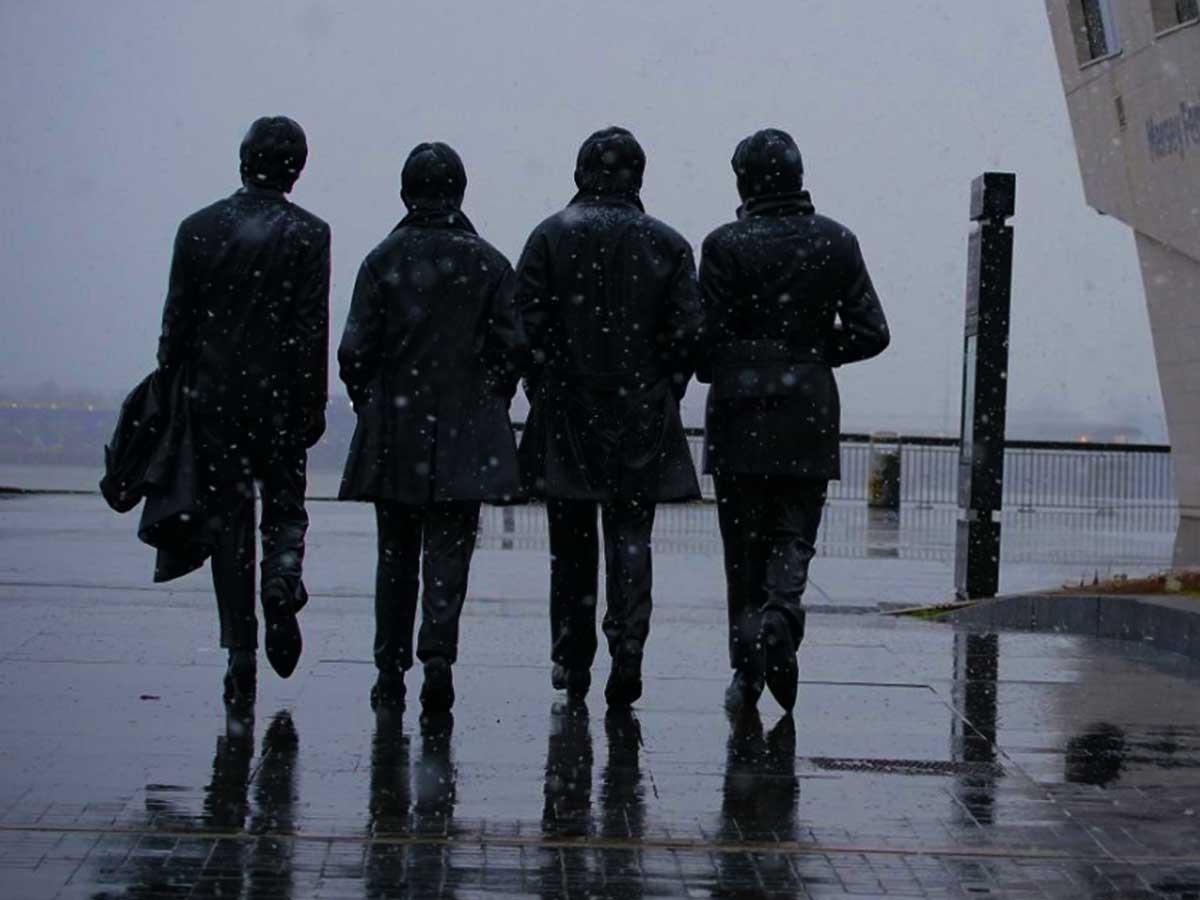 the Beatles statue in the snow at Pier Head in Liverpool