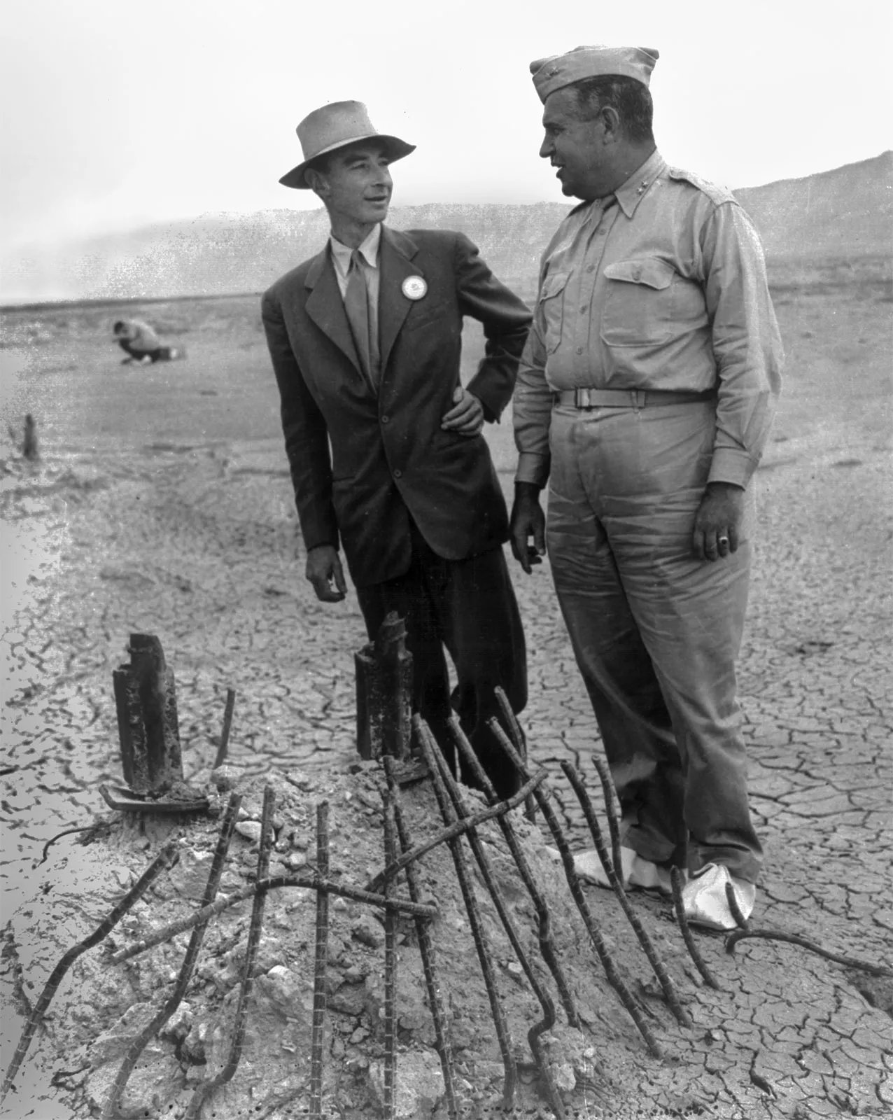 J. Robert Oppenheimer (left) and Gen. Leslie R. Groves examining the remains of a steel tower at the Trinity test site in Alamogordo, New Mexico, September 1945.