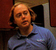 The image showcases Burrell Smith, a key figure in the birth of the Macintosh. Smith, a talented engineer, played a crucial role in the development of the project.