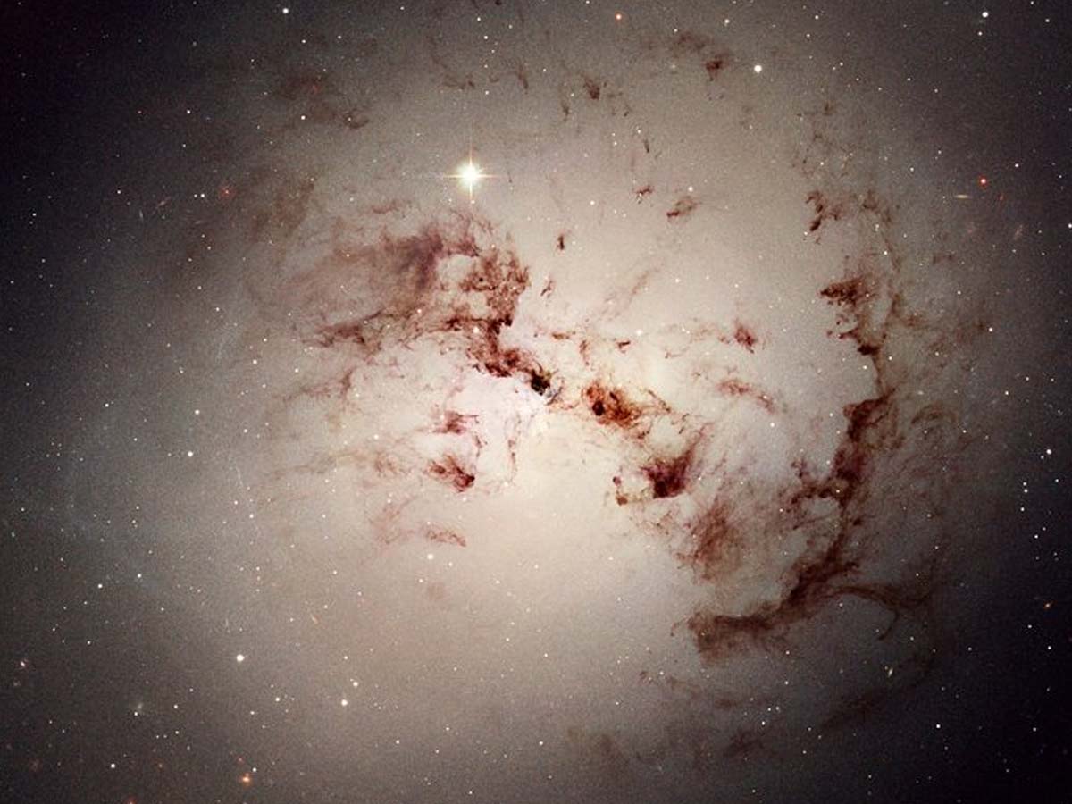 massive_elliptical_galaxy_ngc_1316_intricate_cosmic_dust